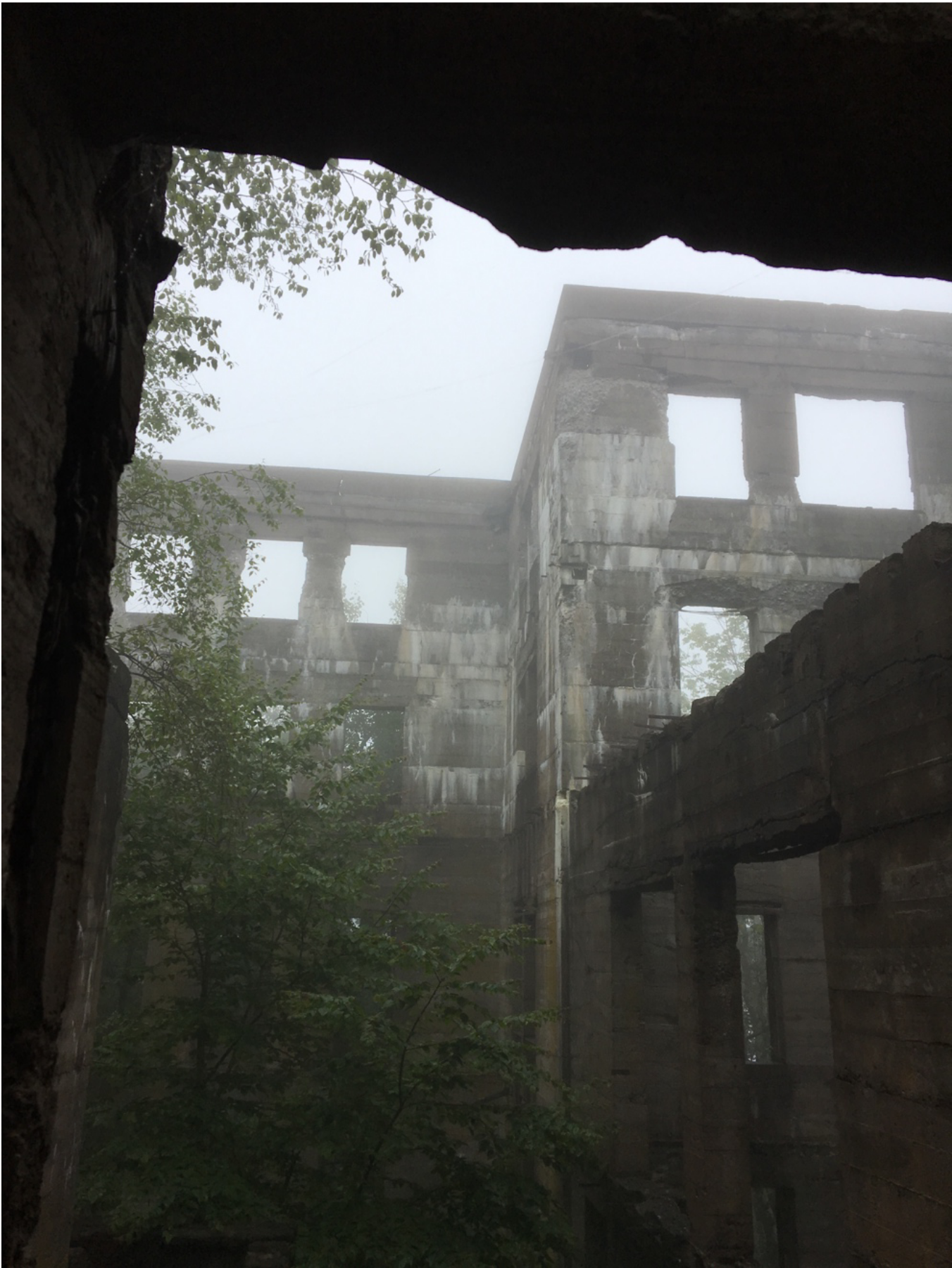 Black and white photograph of abandoned buildings